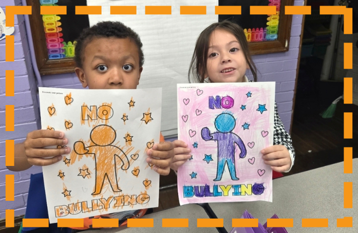 dents holding up a piece of paper